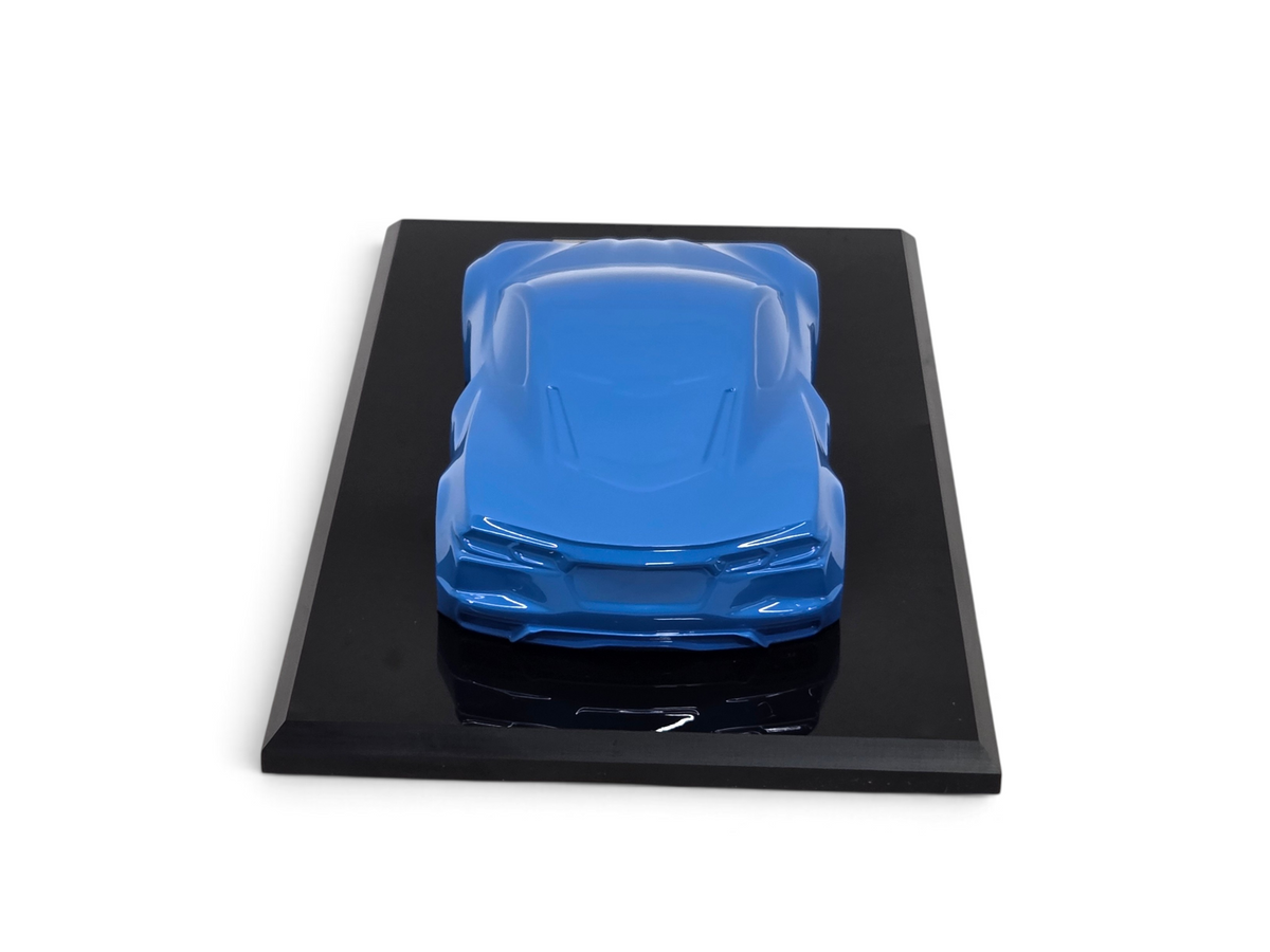 Send it Auto Parts 2022 Corvette C8 Stingray 1:18 scale speedshape model in Rapid Blue on a black display base