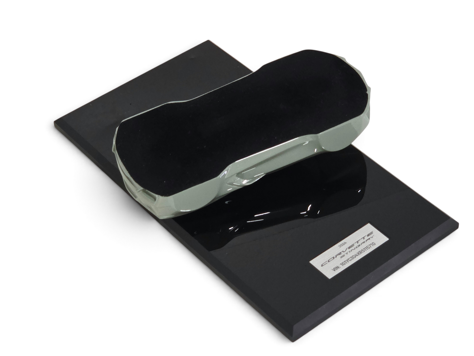 Send it Auto Parts 2024 Corvette C8 speedshape model in Cacti Green on a black display base with VIN plate