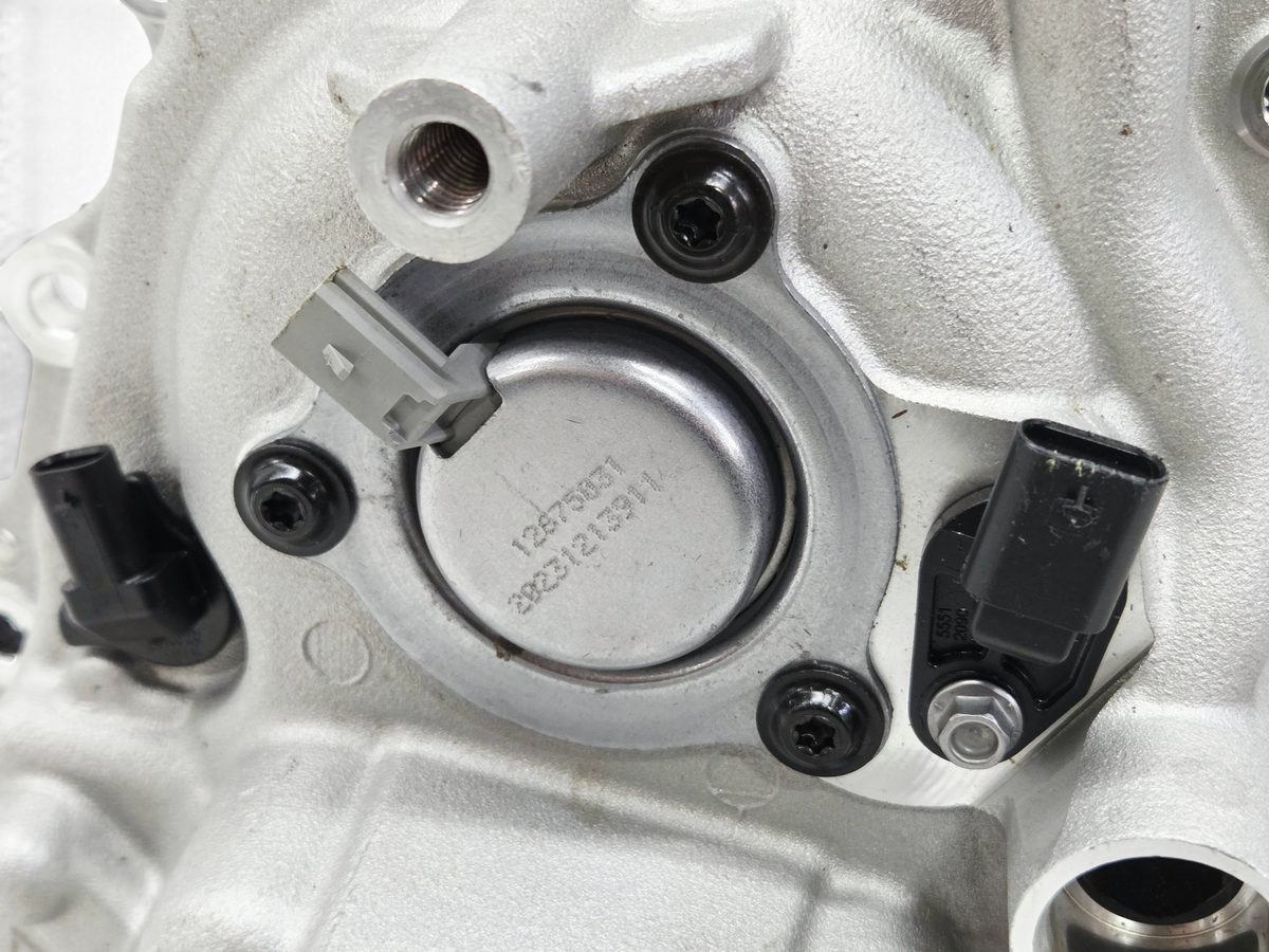 Send it Auto Parts OEM Corvette C8 LT2 engine front cover with installed cam sensor, magnet, and oil pump control valve
