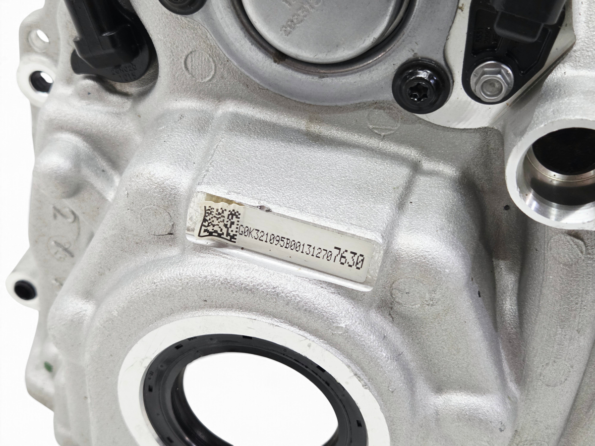 Send it Auto Parts OEM GM Corvette C8 LT2 engine front cover with sensors and oil pump control valve installed.