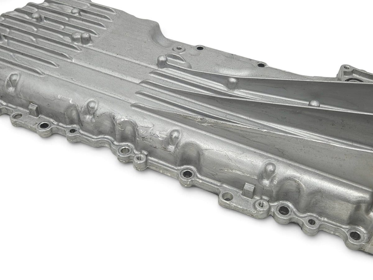 Send it Auto Parts OEM Chevy Corvette C8 6.2L engine oil pan with baffle, silver cast aluminum construction.