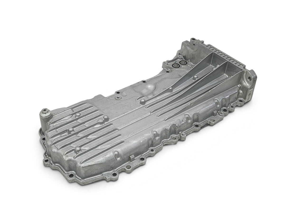 Send it Auto Parts OEM Chevy Corvette C8 6.2L engine oil pan with baffle, silver cast metal automotive component.