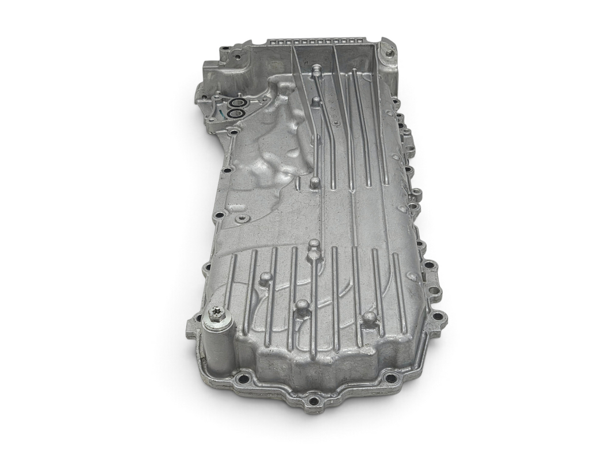 Send it Auto Parts OEM Chevy Corvette C8 6.2L engine oil pan with baffle, showing silver cast metal construction.
