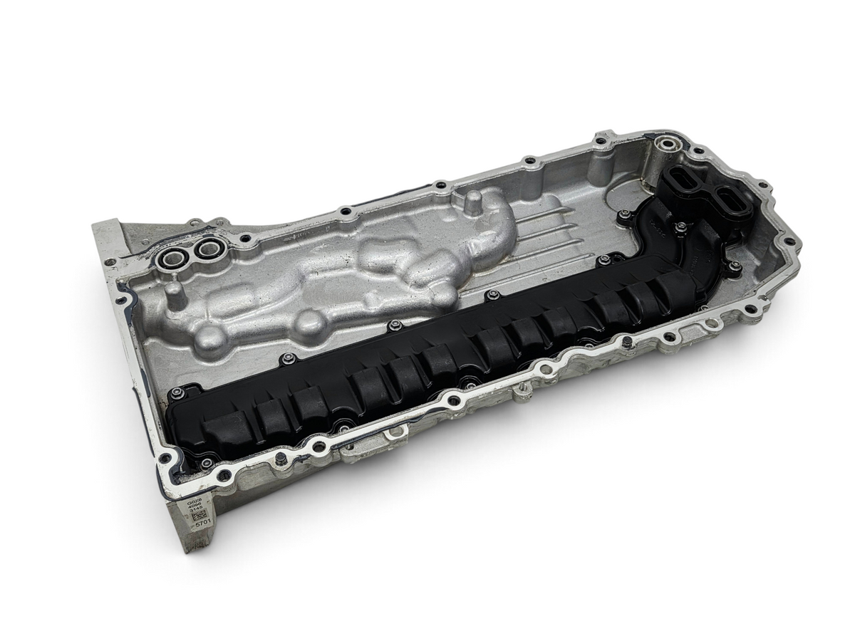 Send it Auto Parts OEM Chevy Corvette C8 6.2L engine oil pan with black baffle, showing mounting bolt holes.