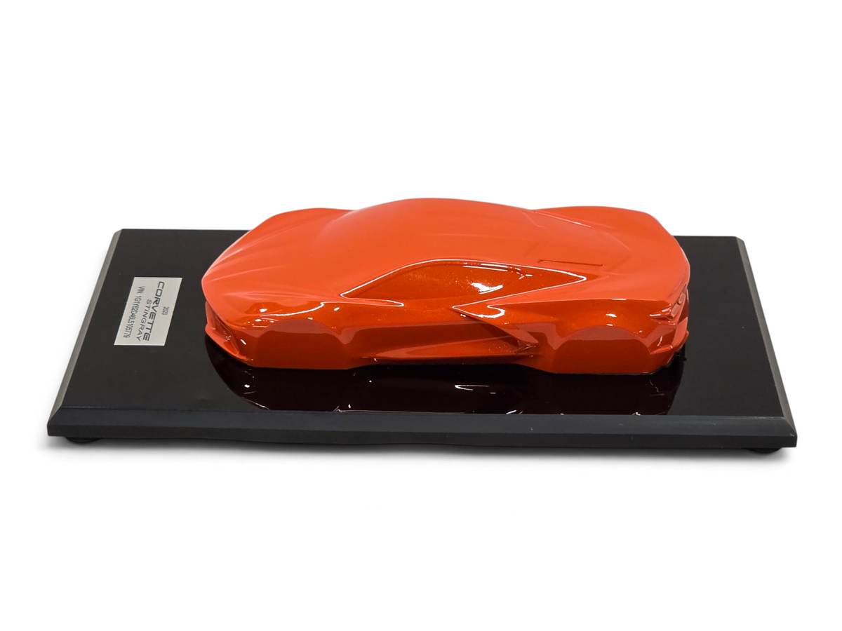 Send it Auto Parts 2020 Corvette C8 Stingray speedshape model in Sebring Orange on a black display base
