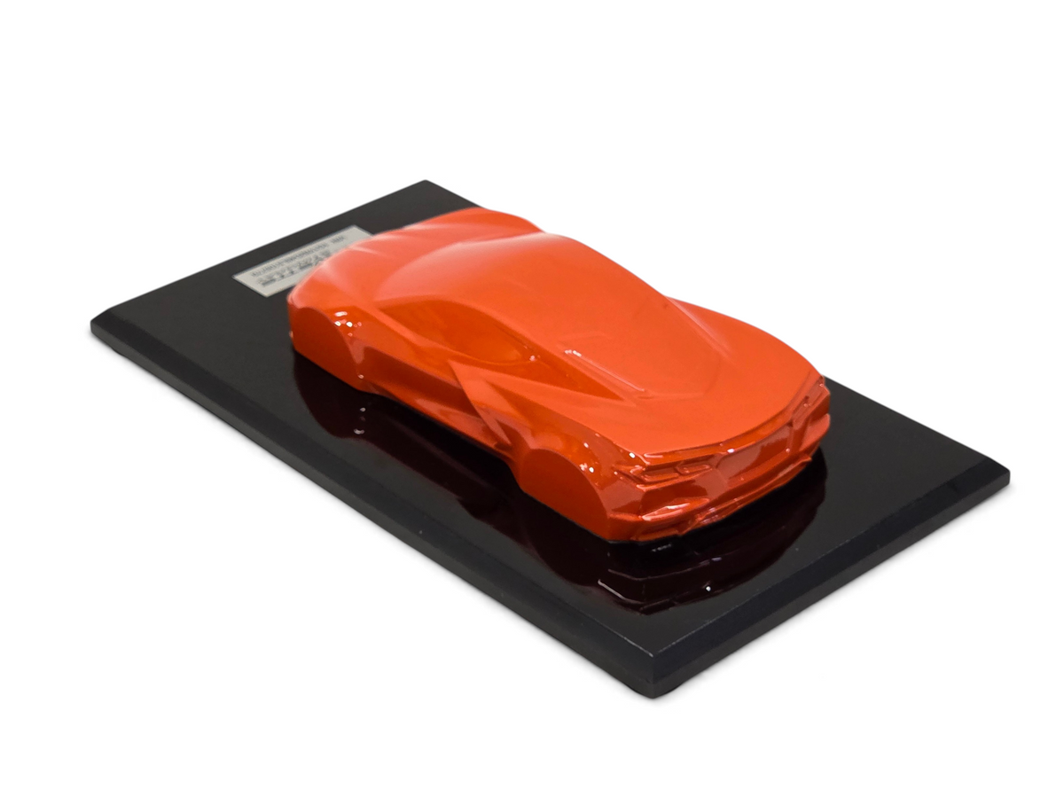 Send it Auto Parts 2020 Corvette C8 Stingray speedshape model in Sebring Orange on a black display base