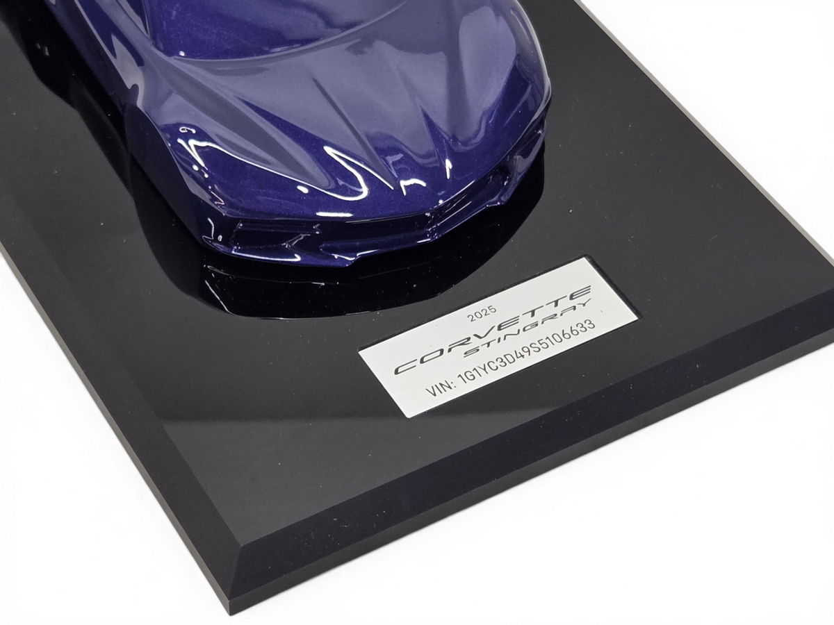 Send it Auto Parts 2025 Corvette C8 Stingray 1:18 scale speedshape model in Hysteria Purple on a black display base.