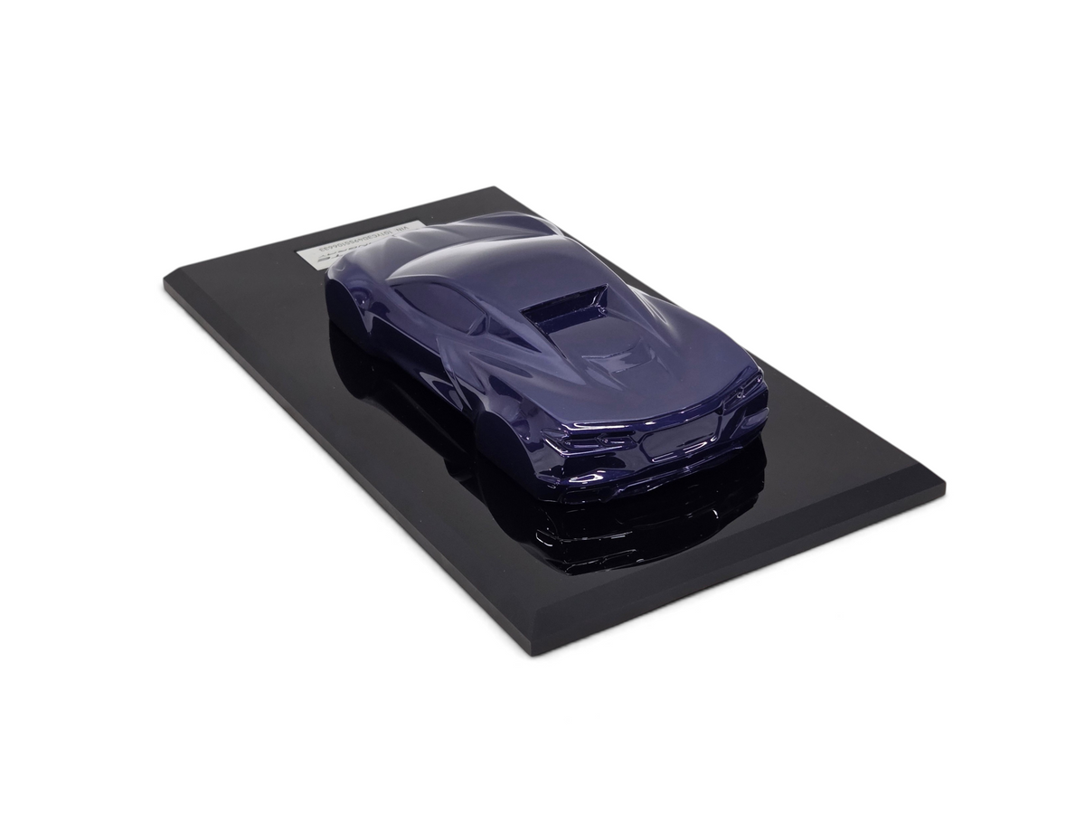 Send it Auto Parts 2025 Corvette C8 Stingray speedshape model in Hysteria Purple on a black display base