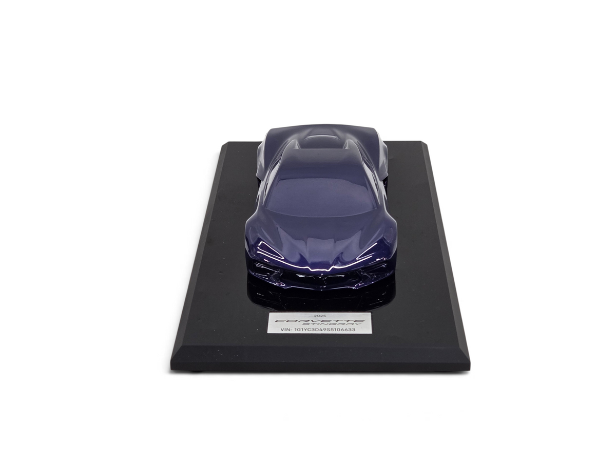 Send it Auto Parts 2025 Corvette C8 Stingray speedshape model in Hysteria Purple on a black display base