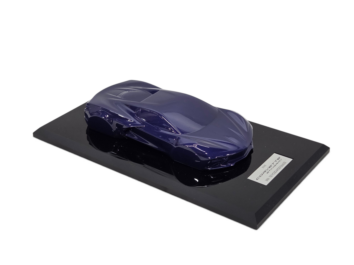 Send it Auto Parts 2025 Corvette C8 Stingray 1:18 scale speedshape model in Hysteria Purple on a black display base.