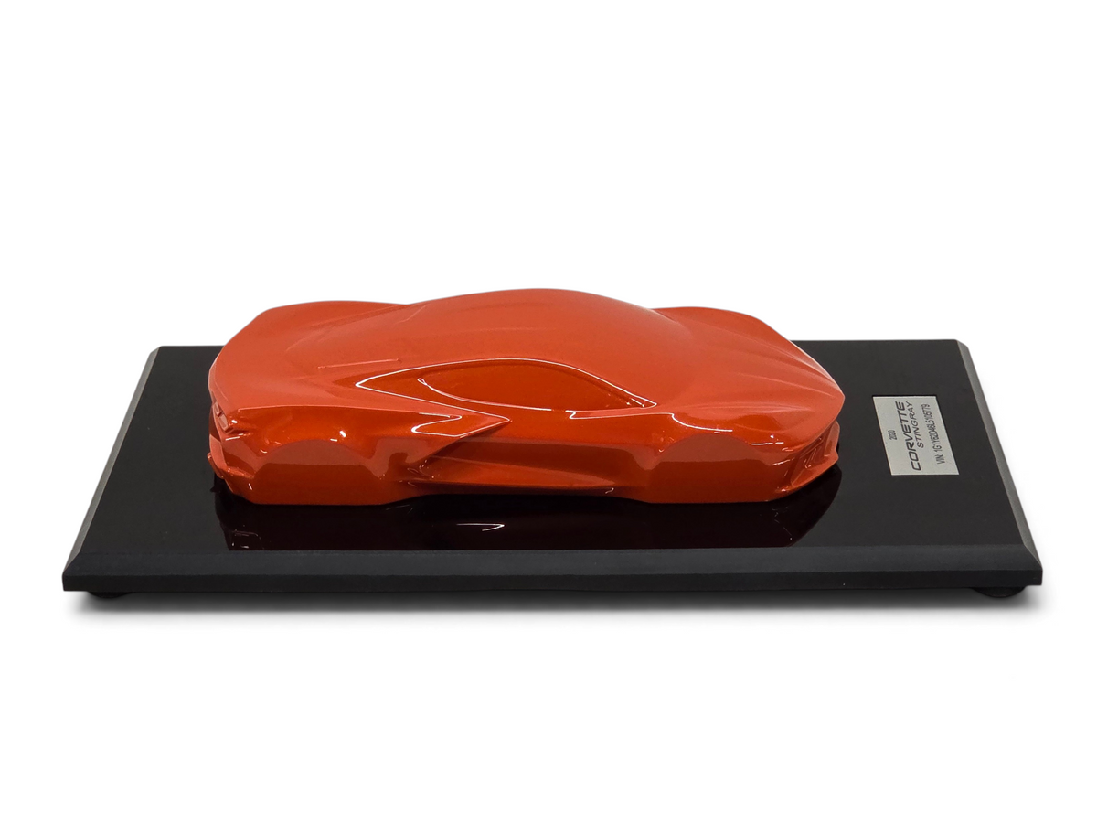 Send it Auto Parts 2020 Corvette C8 Stingray speedshape model in Sebring Orange on a black display base.