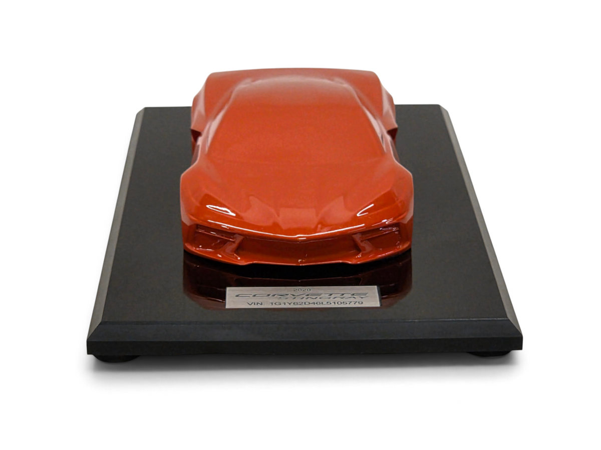Send it Auto Parts 2020 Corvette C8 Stingray speedshape model in Sebring Orange on a black display base