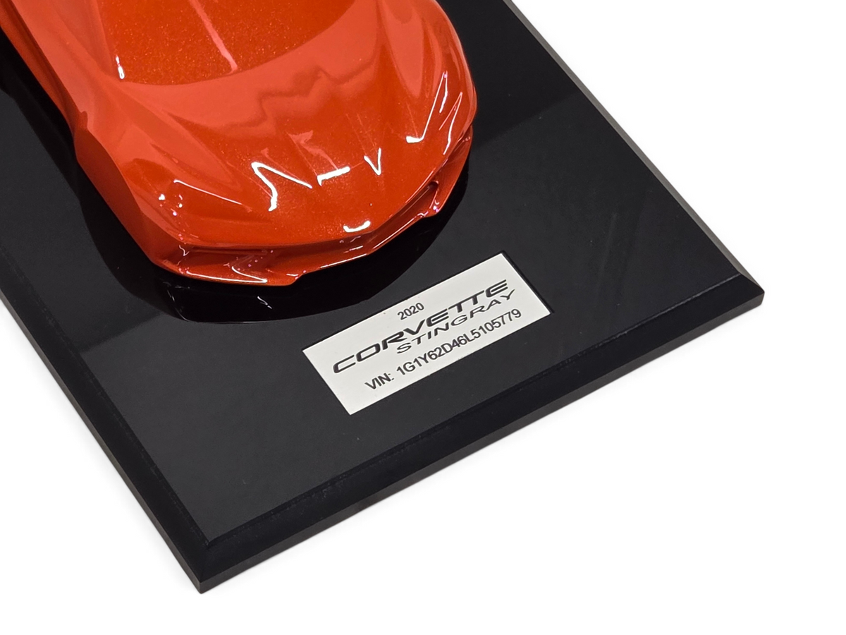 Send it Auto Parts 2020 Corvette C8 Stingray speedshape model in Sebring Orange on a black display base