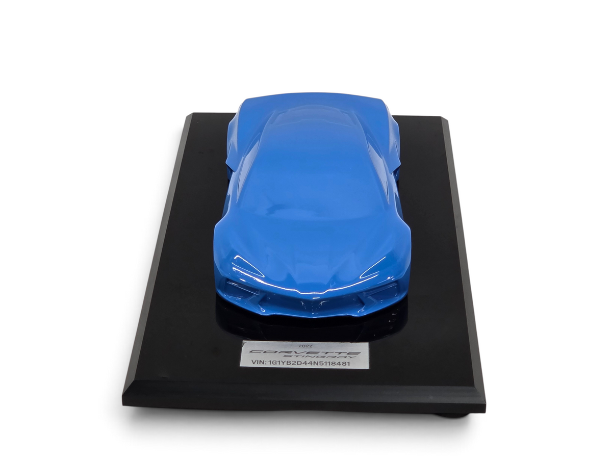 Send it Auto Parts 2022 Corvette C8 Stingray 1:18 scale speedshape model in Rapid Blue on a black display base