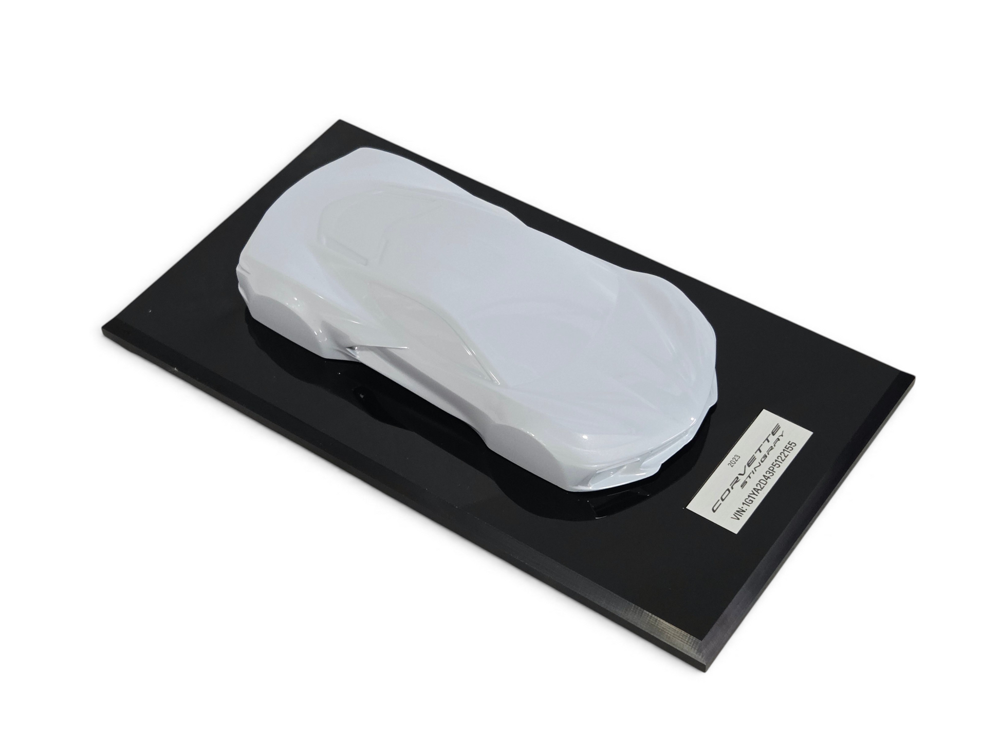 Send it Auto Parts 2023 Corvette C8 1:18 scale speedshape model in ceramic matrix gray on a black display base.