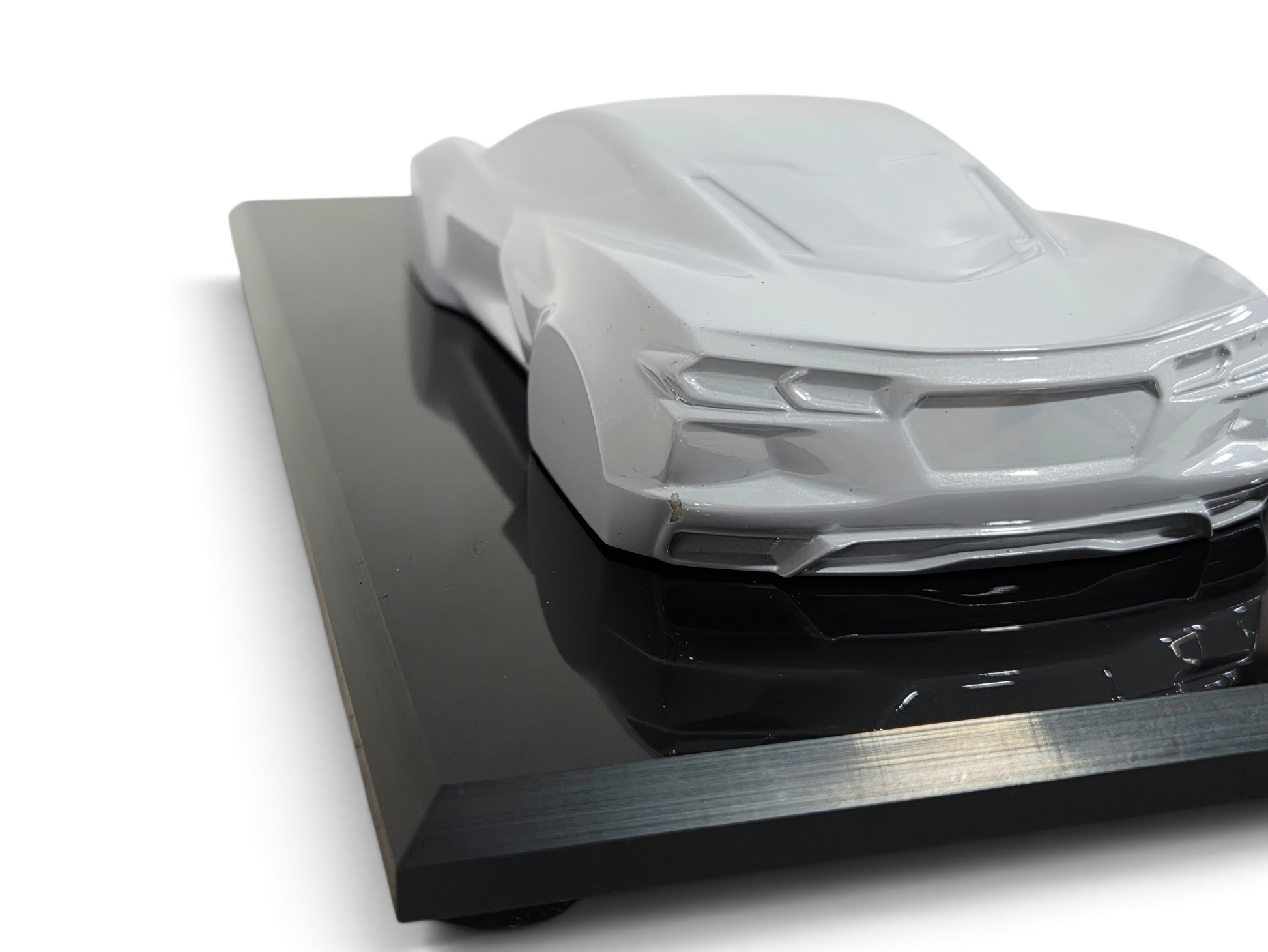 Send it Auto Parts 1:18 scale 2023 Corvette C8 speedshape model in Ceramic Matrix gray on a black display base