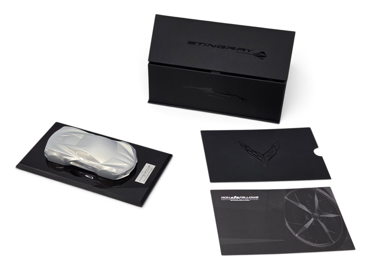 Send it Auto Parts 2023 Corvette C8 Stingray silver flare speedshape model on a display base with box and cards