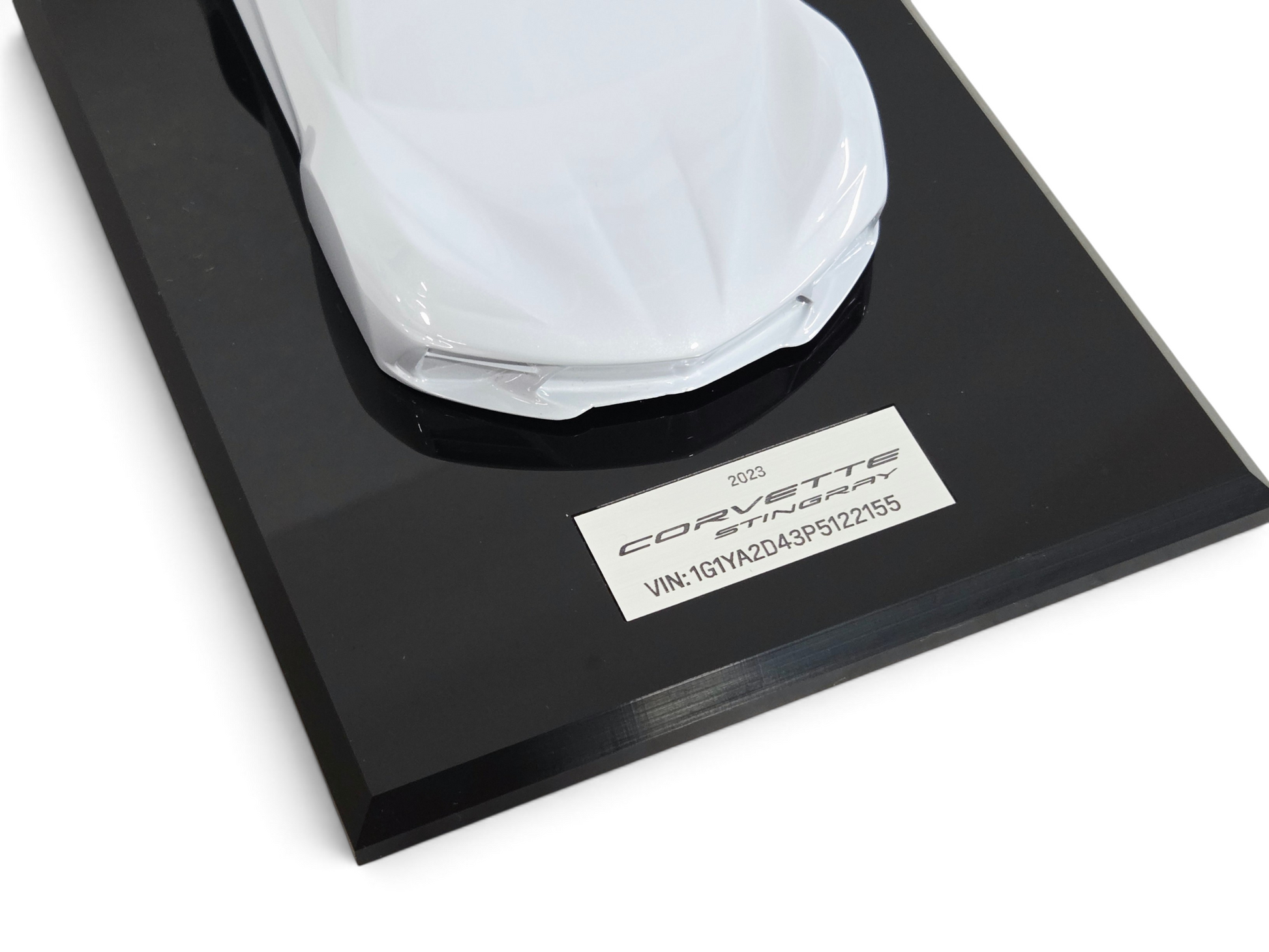 Send it Auto Parts 2023 Corvette C8 1:18 scale speedshape model in ceramic matrix white on a black display base