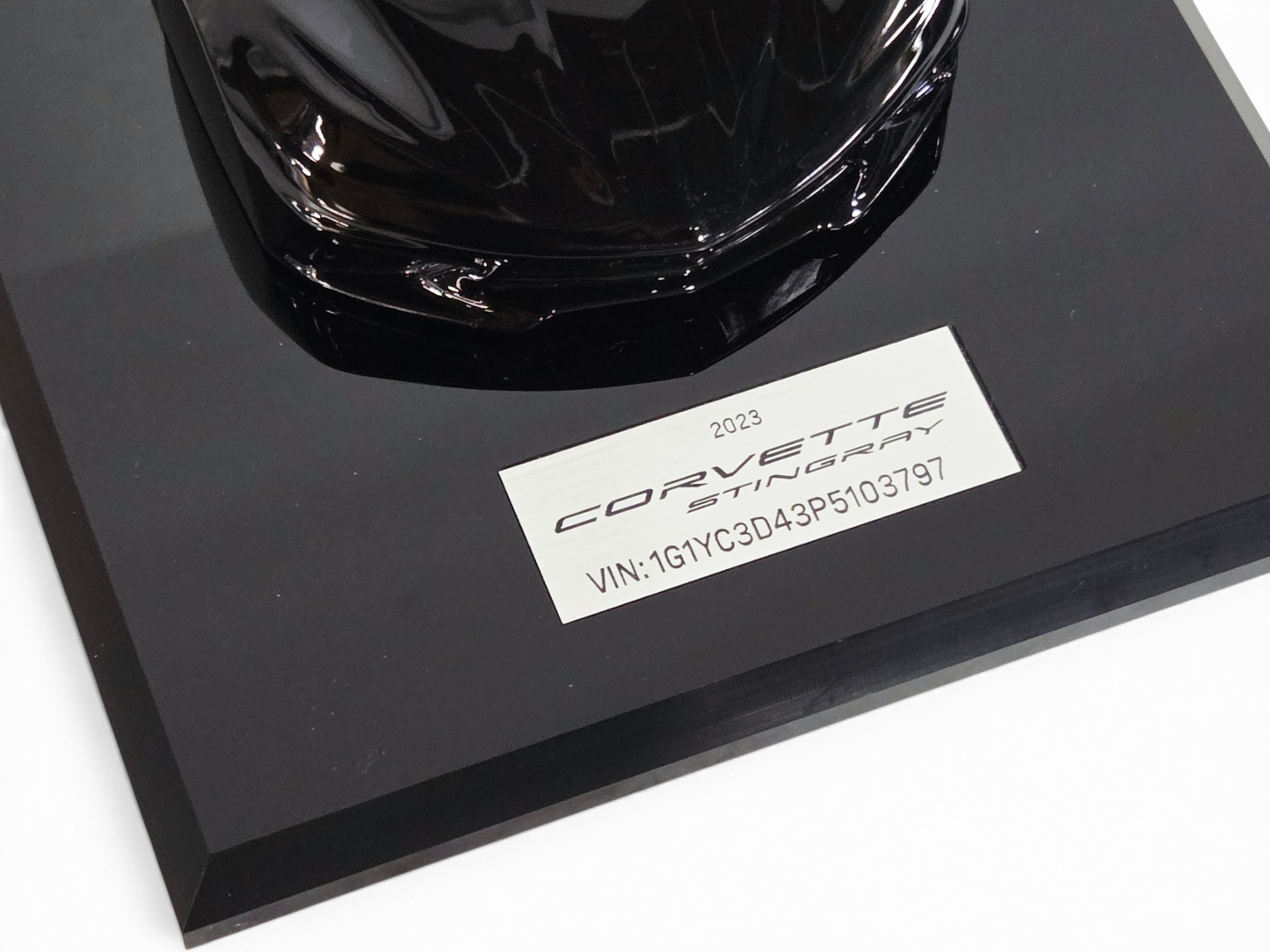 Send it Auto Parts 2023 Corvette C8 black speedshape model on a display base with Stingray plaque
