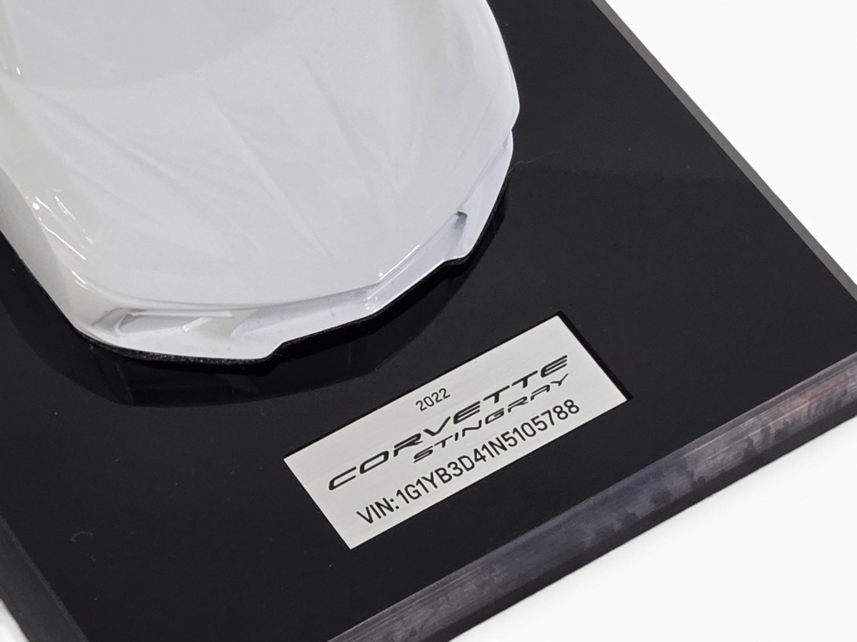 Send it Auto Parts 2022 Corvette C8 Stingray Arctic White 1:18 scale speedshape model on a black display base.