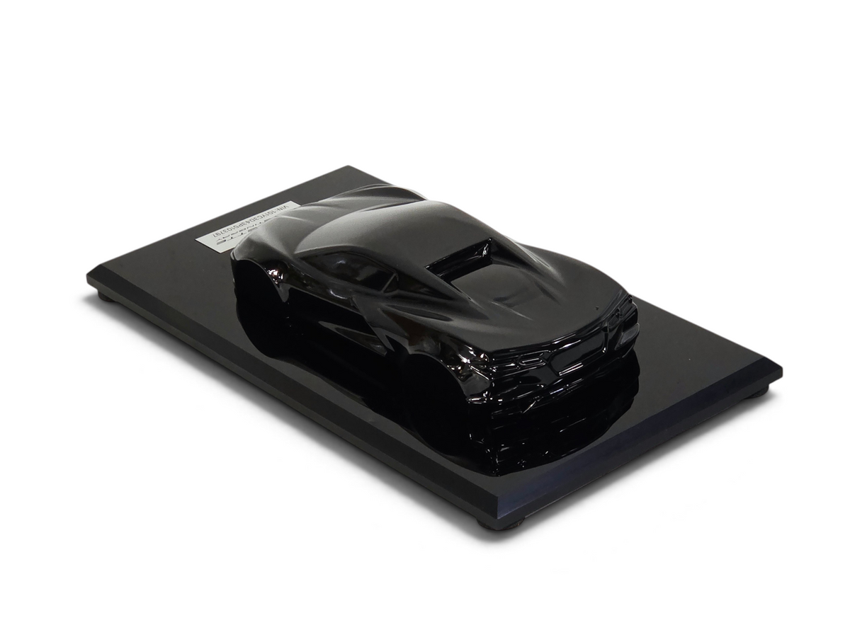 Send it Auto Parts 2023 Corvette C8 black speedshape model on a display base, 1:18 scale automotive collectible.