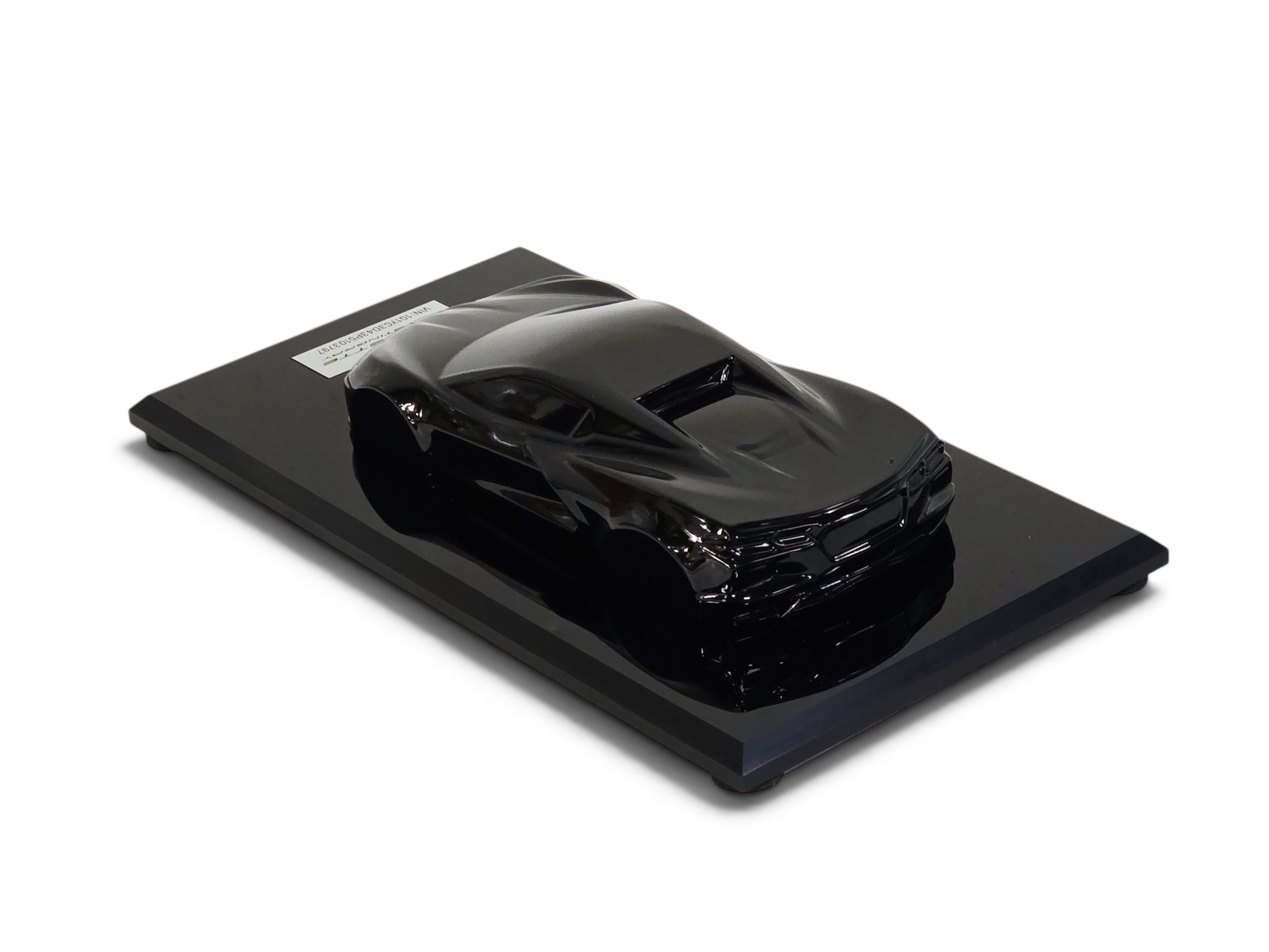 Send it Auto Parts 2023 Corvette C8 black speedshape model on a display base, 1:18 scale automotive collectible.