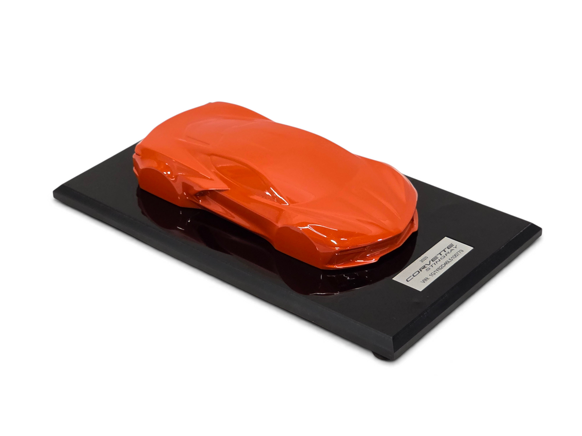 Send it Auto Parts 2020 Corvette C8 Stingray speedshape model in Sebring Orange on a black display base