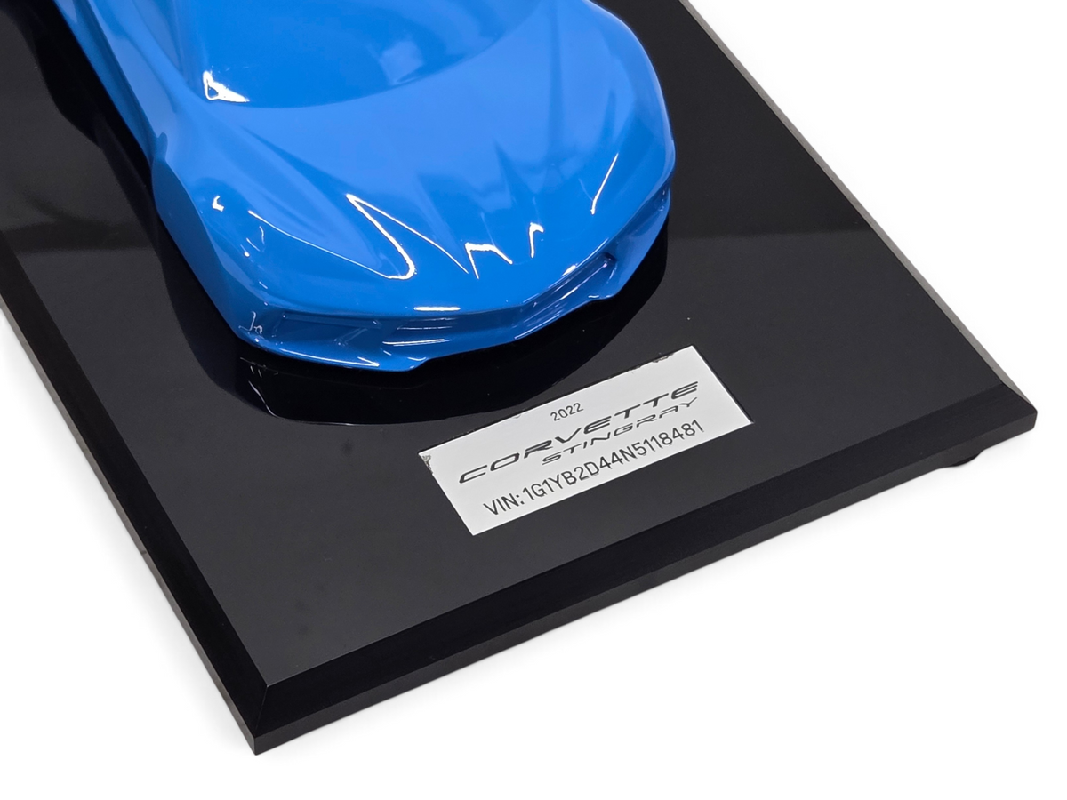 Send it Auto Parts 2022 Corvette C8 Stingray 1:18 scale speedshape model in Rapid Blue on a black display base.