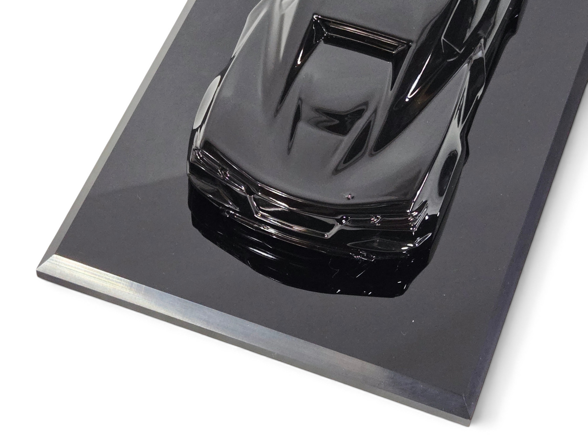 Send it Auto Parts 1:18 scale black 2023 Corvette C8 speedshape model on a black display base
