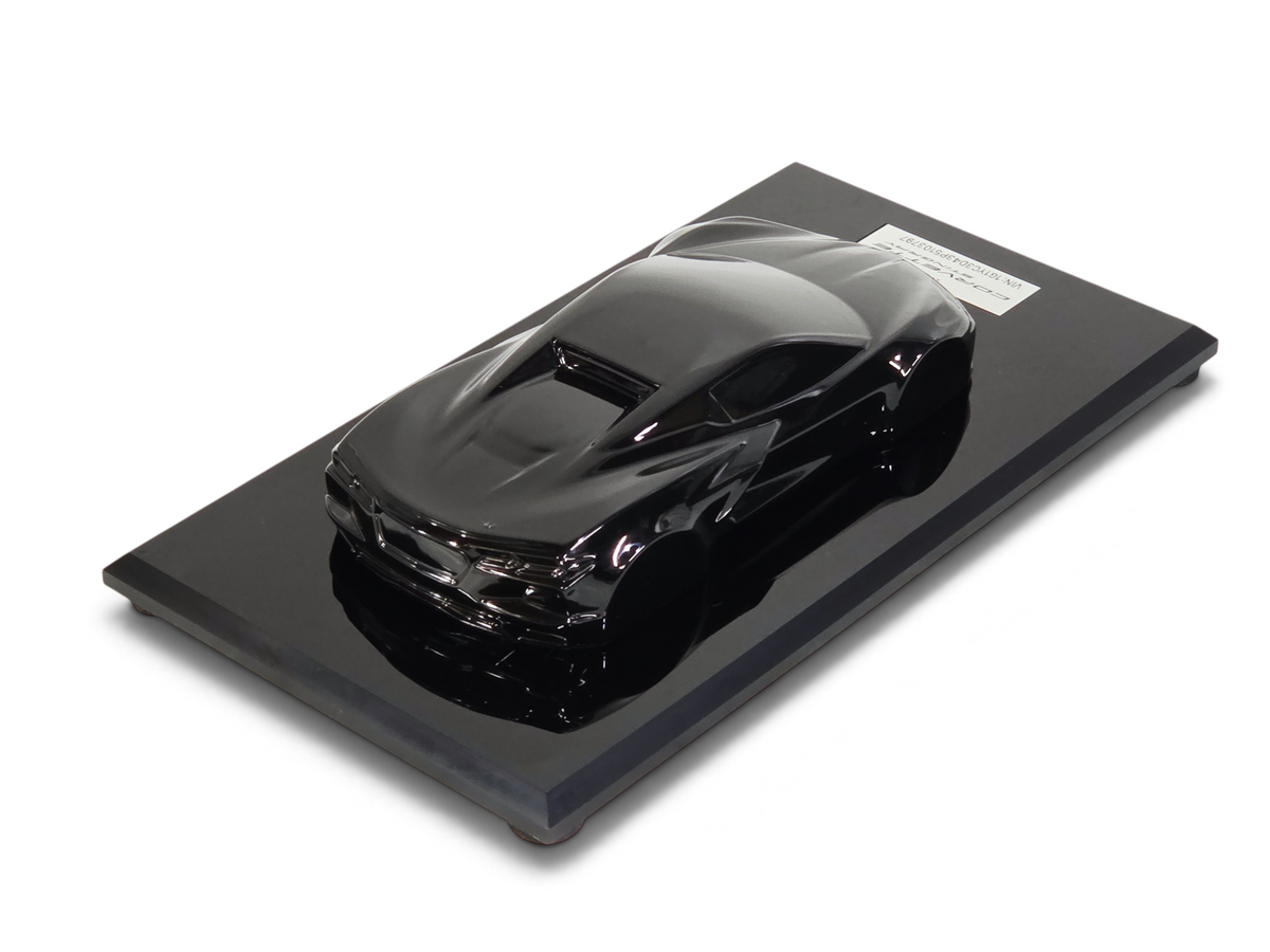 Send it Auto Parts 1:18 scale black 2023 Corvette C8 speedshape model on a black display base
