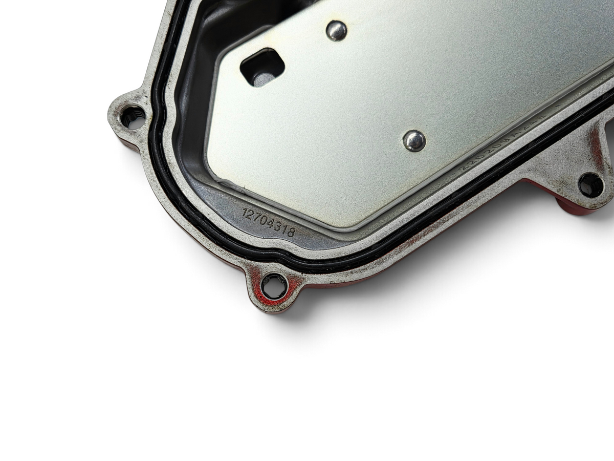 Send it Auto Parts OEM Chevy Corvette C8 6.2L engine valve cover showing part number 12704318 and metal construction.
