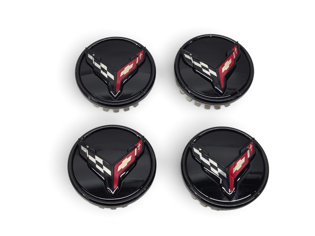 Send it Auto Parts set of four gloss black OEM GM wheel center caps for 2020-2026 Corvette C8 Stingray