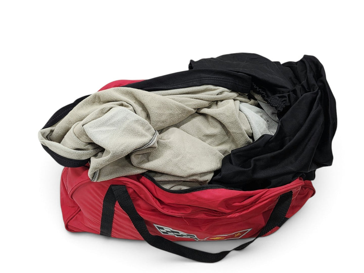 Send it Auto Parts OEM Corvette C6 ZR1 indoor car cover in a red carry bag with black and beige fabric