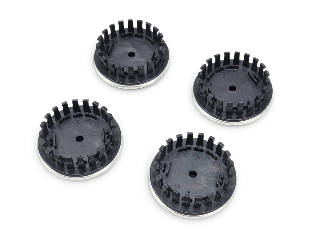 Send it Auto Parts OEM GM Corvette C8 wheel center caps with Jake logo, showing the black plastic back side