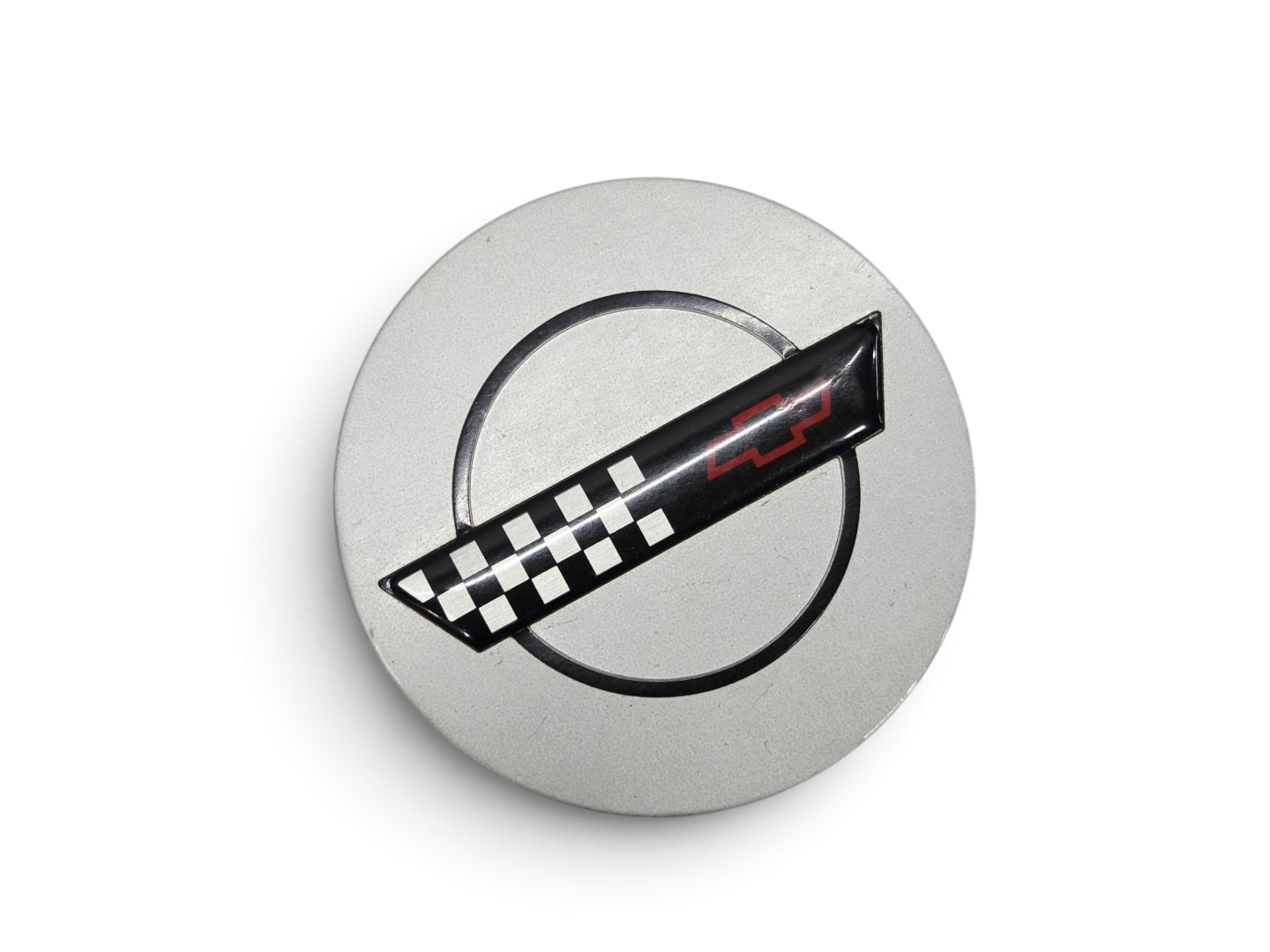 Send it Auto Parts OEM silver wheel center cap for 1991-1995 Corvette C4 ZR-1 with checkered flag emblem