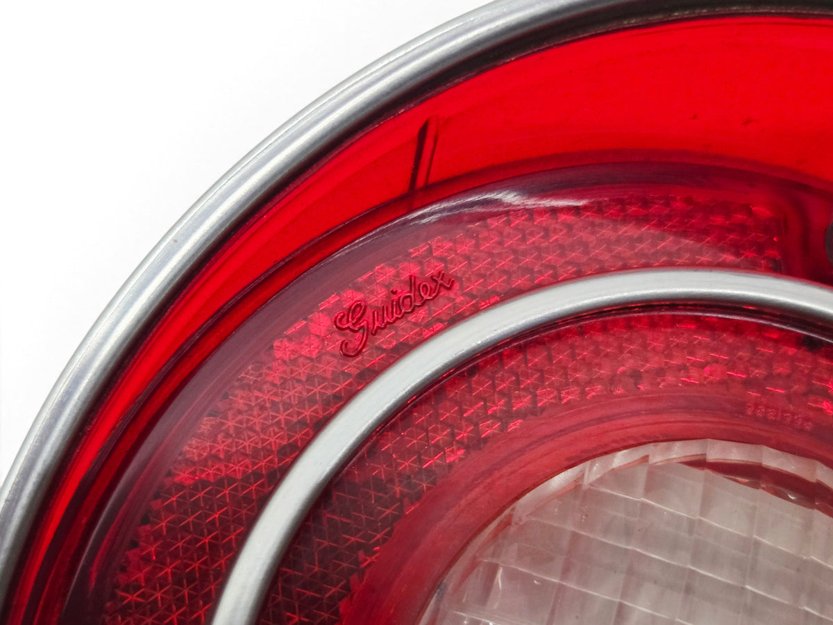 Send it Auto Parts 1971 Corvette OEM red backup lamp tail light lens with Guide branding and chrome trim