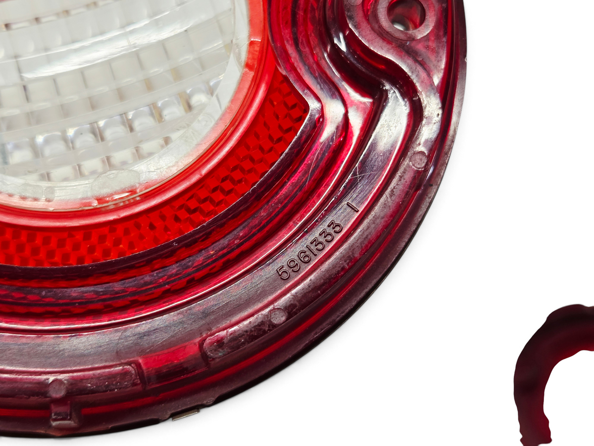 Send it Auto Parts OEM 1971 Corvette backup lamp tail light lens with part number 5961333 in red and clear plastic