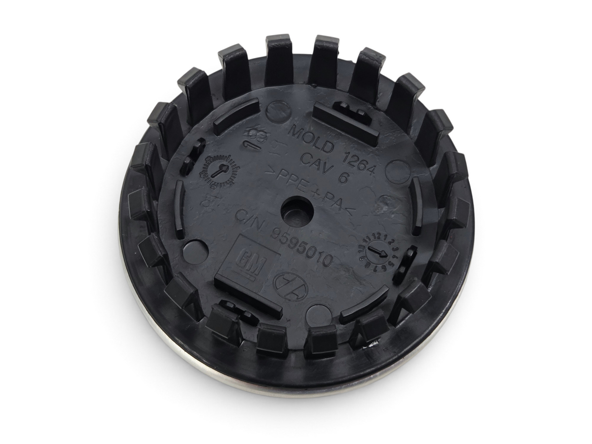 Send it Auto Parts OEM GM Corvette C8 wheel center cap back view showing plastic molding and part number 9595010