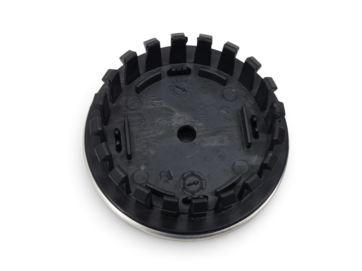 Send it Auto Parts OEM GM Corvette C8 wheel center cap with Jake logo, showing the black plastic back side