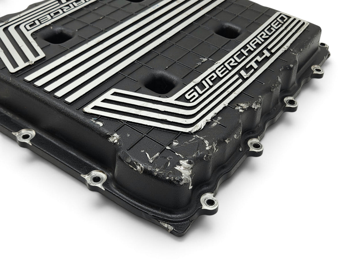 Send it Auto Parts damaged OEM GM LT4 6.2L supercharger cover lid for Chevy Camaro ZL1 with visible surface cracks