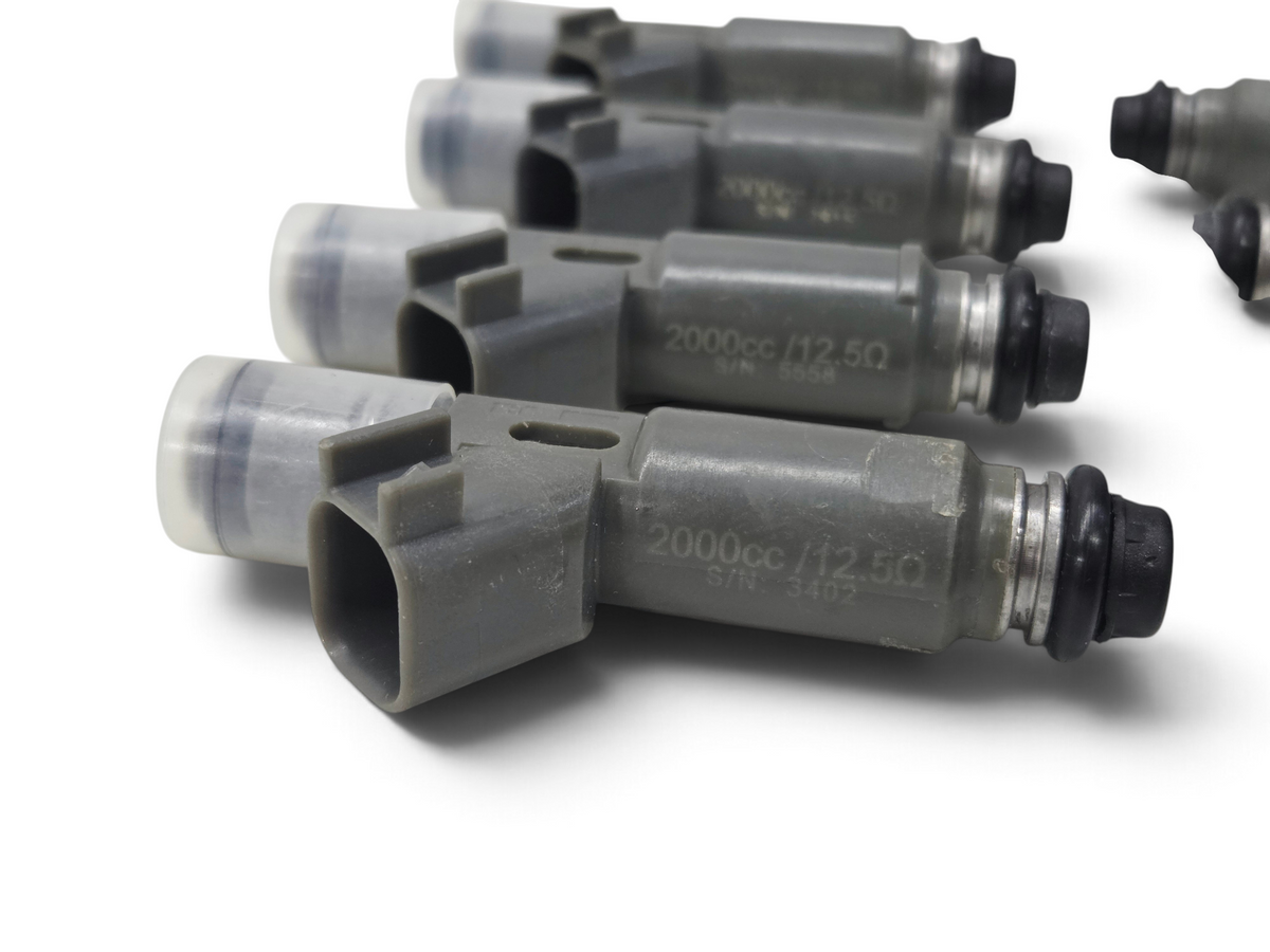 Send it Auto Parts Denso 2000cc high impedance fuel injectors with EV6 connectors, set of eight grey automotive parts.