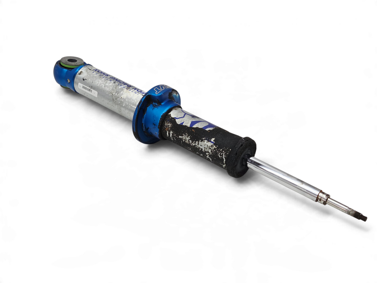 Send it Auto Parts Ford F150 SVT Raptor front shock absorber for repair, featuring blue and silver metal finish.