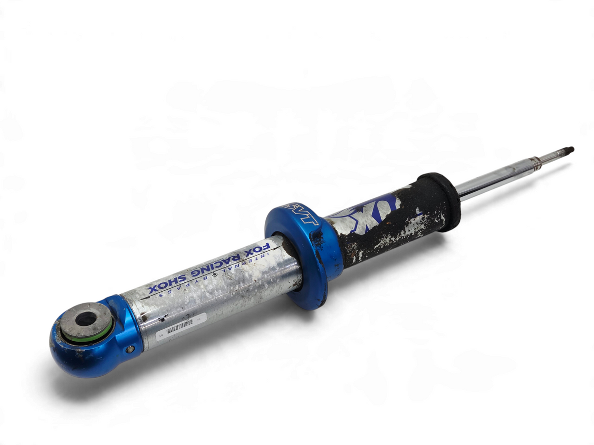 Send it Auto Parts Ford F150 SVT Raptor front shock absorber for repair, featuring blue and silver metal finish.