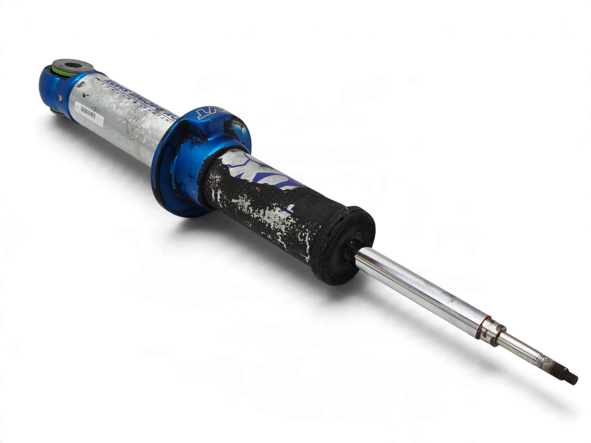 Send it Auto Parts Ford F150 SVT Raptor front shock absorber for repair, featuring blue and silver metal components.