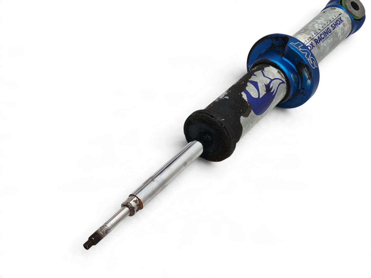 Send it Auto Parts Ford F150 SVT Raptor front shock absorber for repair, featuring blue and silver metal finish.