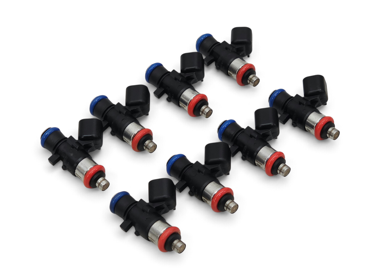 Send it Auto Parts set of 8 OEM GM 56lb fuel injectors for 6.2L LSA LS9 engines with black bodies and blue and red seals.