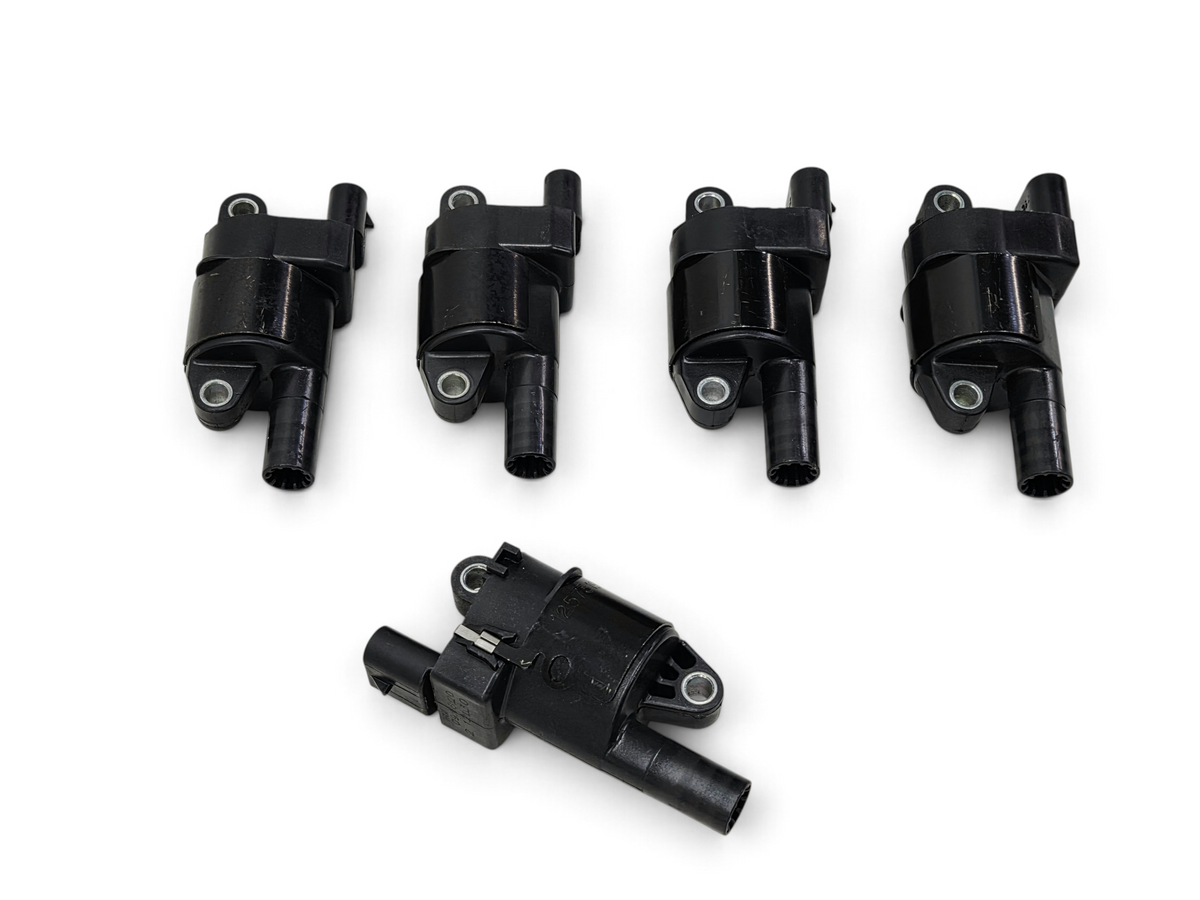 Send it Auto Parts set of five OEM round ignition coils for GM LS engines, part number 12573190 in black plastic.