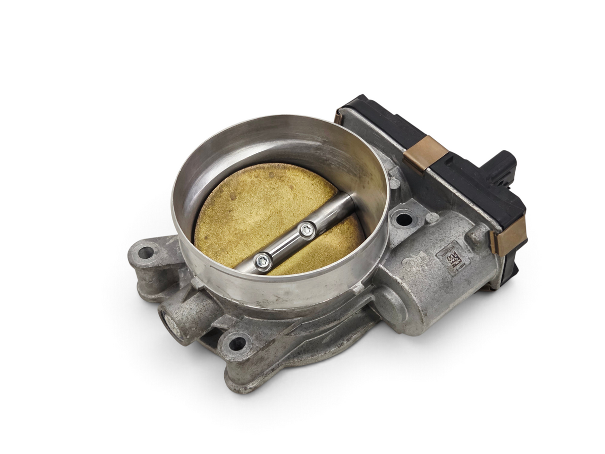 ACDelco GM fuel injection throttle body from Send it Auto Parts, featuring a metallic housing and brass butterfly valve.