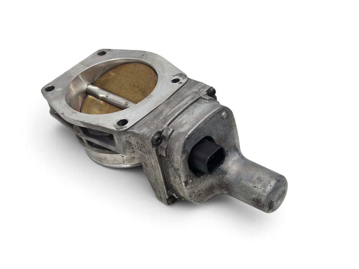 Send it Auto Parts OEM GM LS3 LS7 gold blade throttle body for Chevrolet V8 engines, showing metal housing and port.