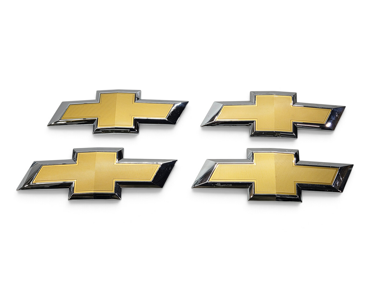 Send it Auto Parts lot of four gold and chrome OEM Chevrolet Silverado 1500 front grille bowtie emblems